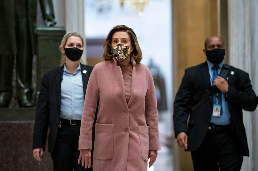 Accompanied by her security detail, Speaker of the House Nancy Pelosi (D-CA) leaves her office and walks to the House Chamber at the U.S. Capitol on Jan. 21, 2021 in Washington, D.C. (Drew Angerer/Getty Images)