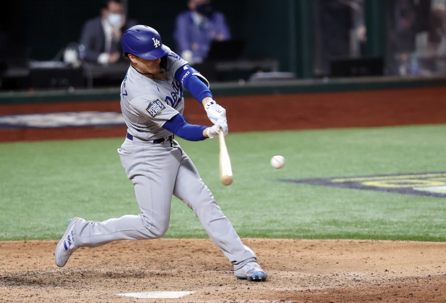 Enrique Hernandez #14 of the Los Angeles Dodgers hits an RBI double against the Tampa Bay Rays during the sixth inning in Game Four of the 2020 MLB World Series at Globe Life Field on October 24, 2020 in Arlington, Texas. (Tom Pennington/Getty Images)