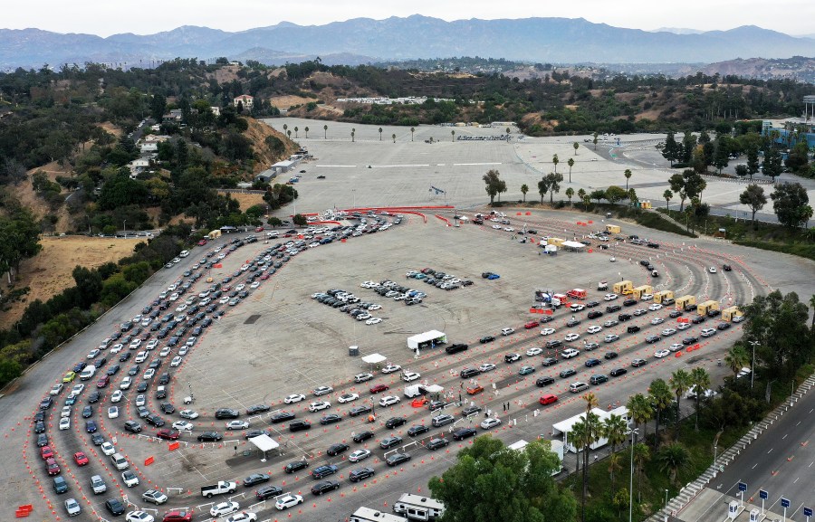 In an aerial view from a drone, vehicles line up to enter a testing site at Dodger Stadium on Dec. 7, 2020 in Los Angeles. (Mario Tama/Getty Images)