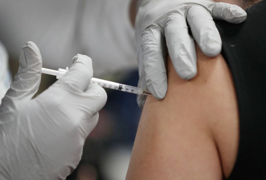 A healthcare worker receives a Pfizer COVID-19 at the Jackson Memorial Hospital on Dec. 15, 2020 in Miami, Florida. (Joe Raedle/Getty Images)