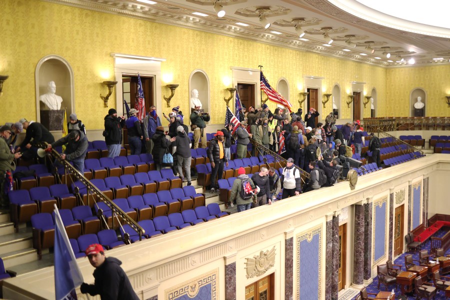 Protesters enter the Senate Chamber on January 06, 2021 in Washington, DC. Congress held a joint session today to ratify President-elect Joe Biden's 306-232 Electoral College win over President Donald Trump. (Win McNamee/Getty Images)