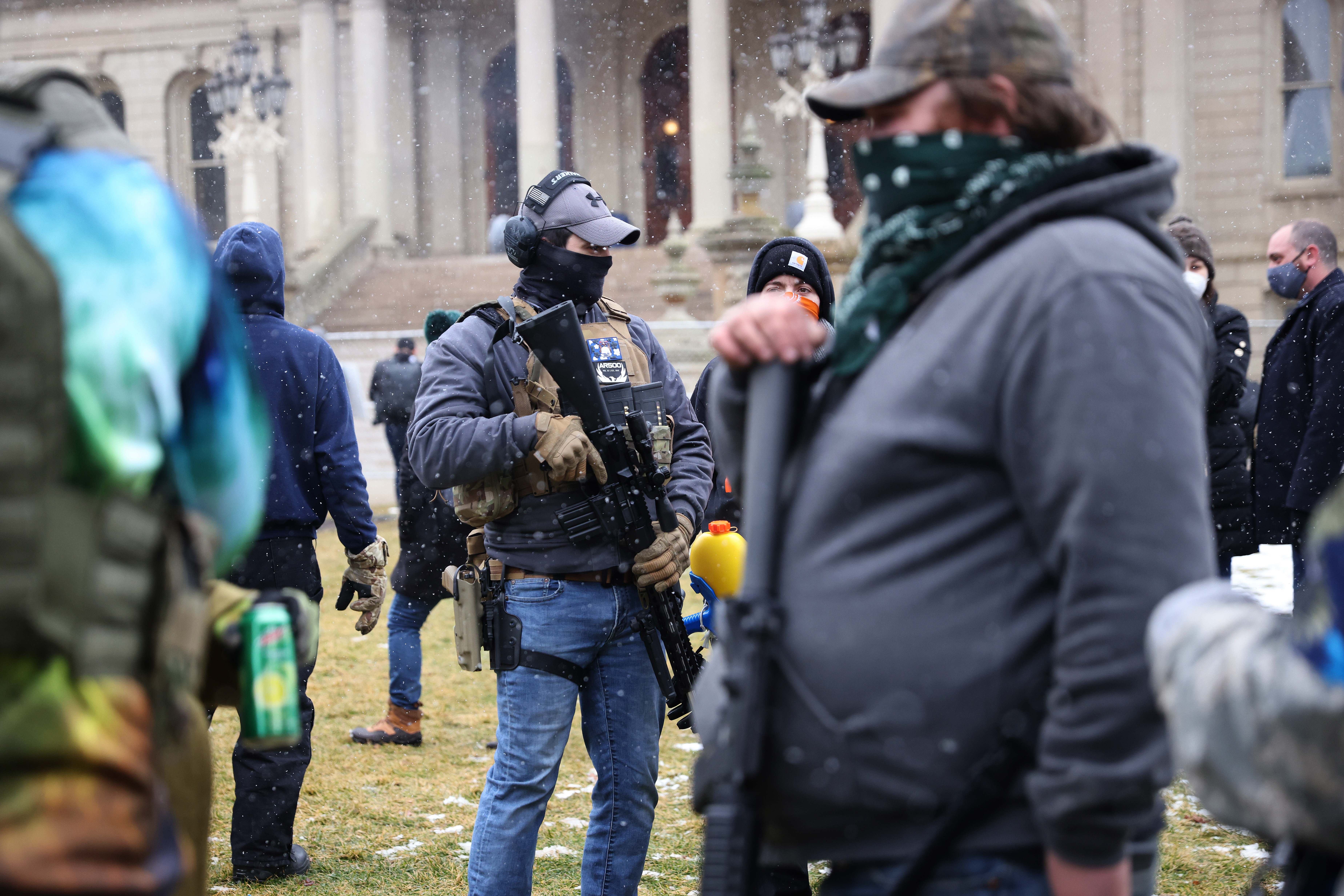 Armed demonstrators protest outside of the Michigan state capital building on Jan. 17, 2021 in Lansing, Michigan. (Scott Olson/Getty Images)