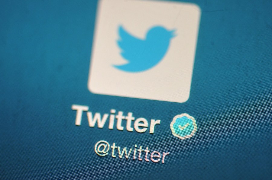 In this photo illustration, The Twitter logo is displayed on a mobile device. (Bethany Clarke/Getty Images)