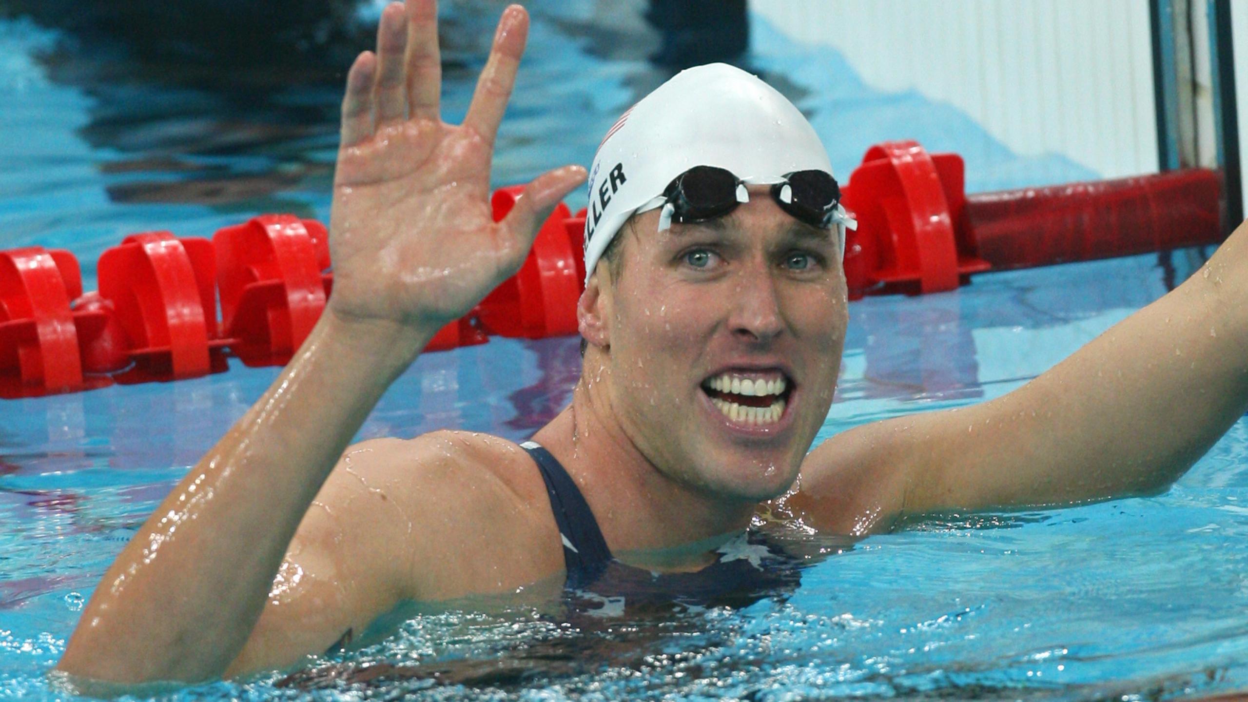 Swimmer Klete Keller smiles after winning the men's 4 x 200m freestyle relay swimming heat in the 2008 Beijing Olympic Games on Aug. 12, 2008. (Greg Wood / AFP / Getty Images)