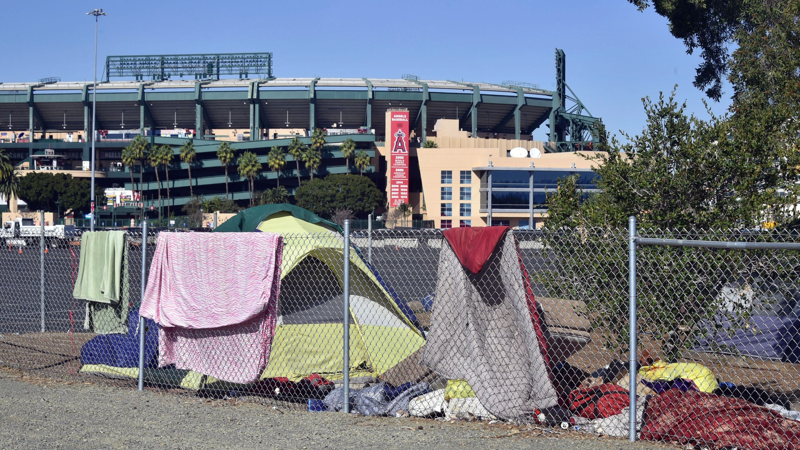 Blankets and tents are seen at a homeless encampment along the Santa Ana river bed near Angel Stadium in Anaheim, California on Jan. 23, 2018.(FREDERIC J. BROWN/AFP via Getty Images)