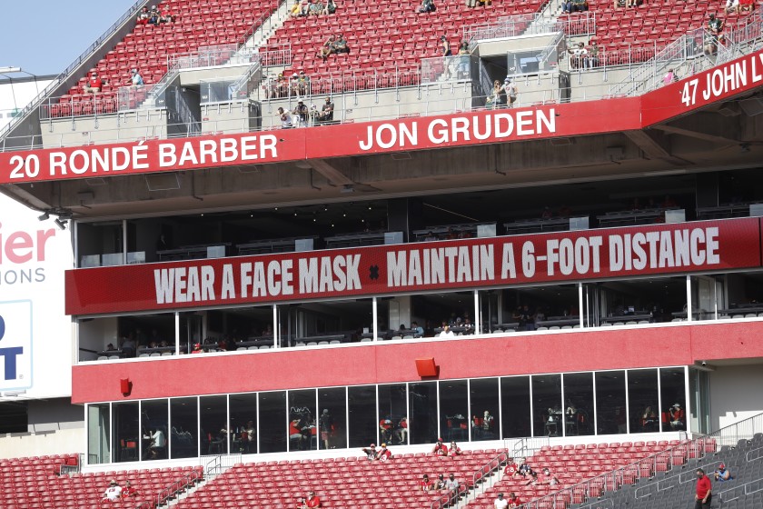 At Raymond James Stadium in Tampa, Fla., site of the upcoming Super Bowl, signs remind attendees to take precautions against transmission of the virus.(Jason Armond / Los Angeles Times)