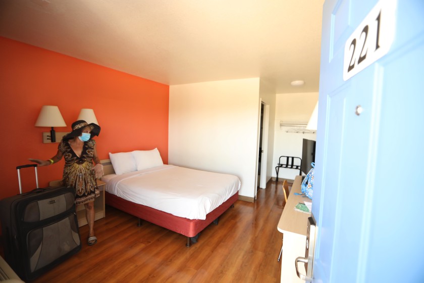 Genia Hope, 52, moves into her new room at a hotel that is being used for Project Roomkey in Whittier on July 7, 2020. (Genaro Molina / Los Angeles Times)