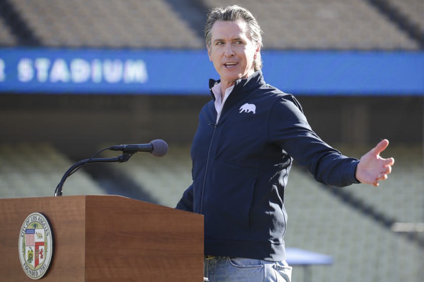 Governor Gavin Newsom holds a press conference at Dodger Stadium on Friday, Jan. 15, 2021. More than 50 Bay Area restaurants are suing Newsom over the outdoor dining ban. (Irfan Khan/Los Angeles Times)