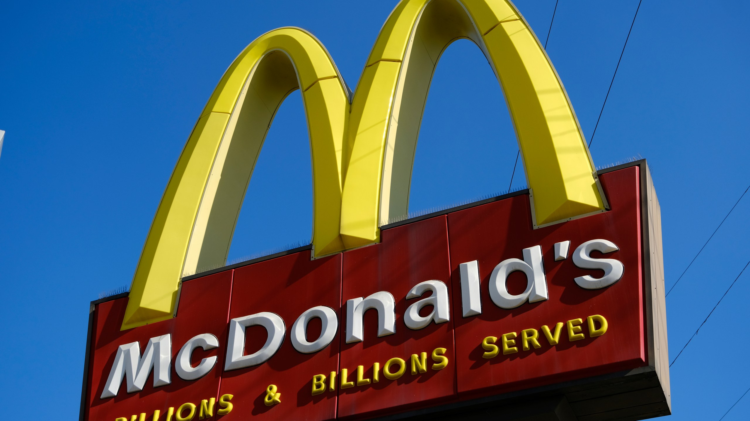 This file photo shows McDonald's sign above one of the fast food restaurant’s California locations on Nov. 25, 2019. (Richard Vogel / Associated Press)