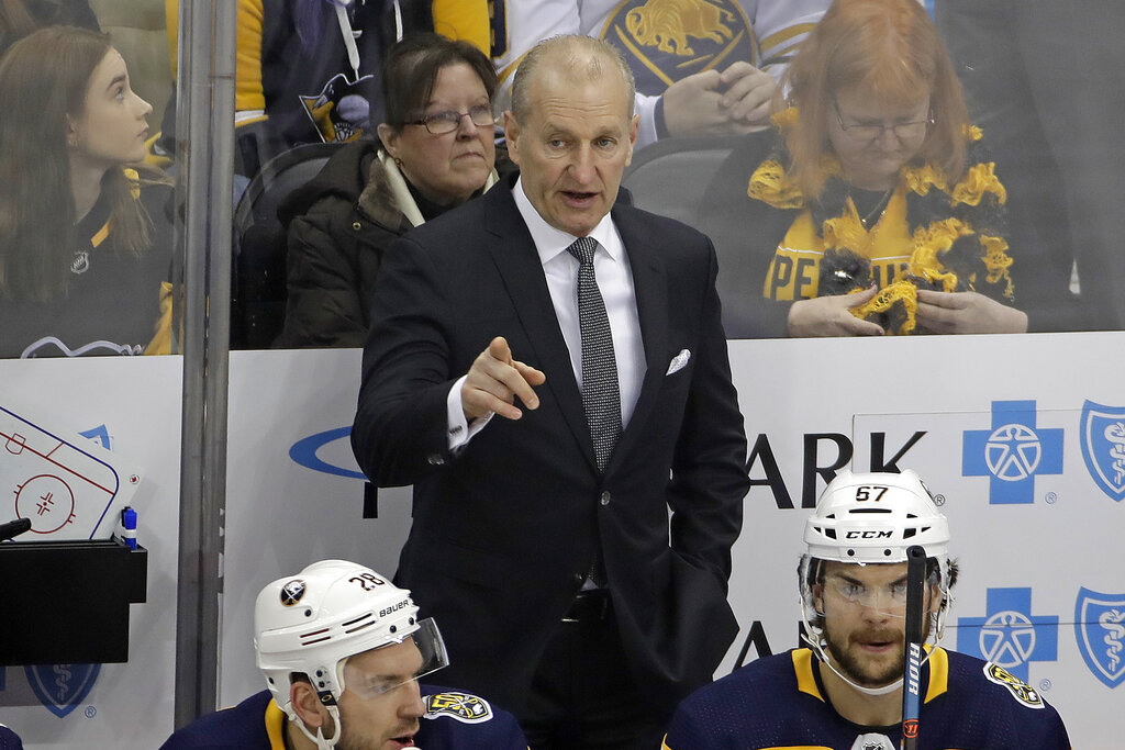 Buffalo Sabres' head coach Ralph Krueger stands behind his bench during the first period of the team's NHL hockey game against the Pittsburgh Penguins in Pittsburgh, in this Saturday, Feb. 22, 2020. (AP Photo/Gene J. Puskar, File)