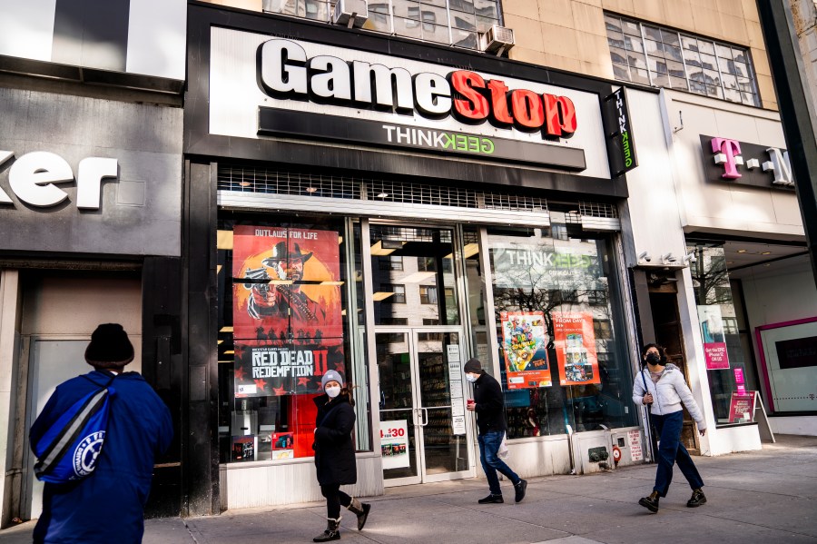 Pedestrians pass a GameStop store on 14th Street at Union Square in Manhattan on Jan. 28, 2021. (John Minchillo / Associated Press)