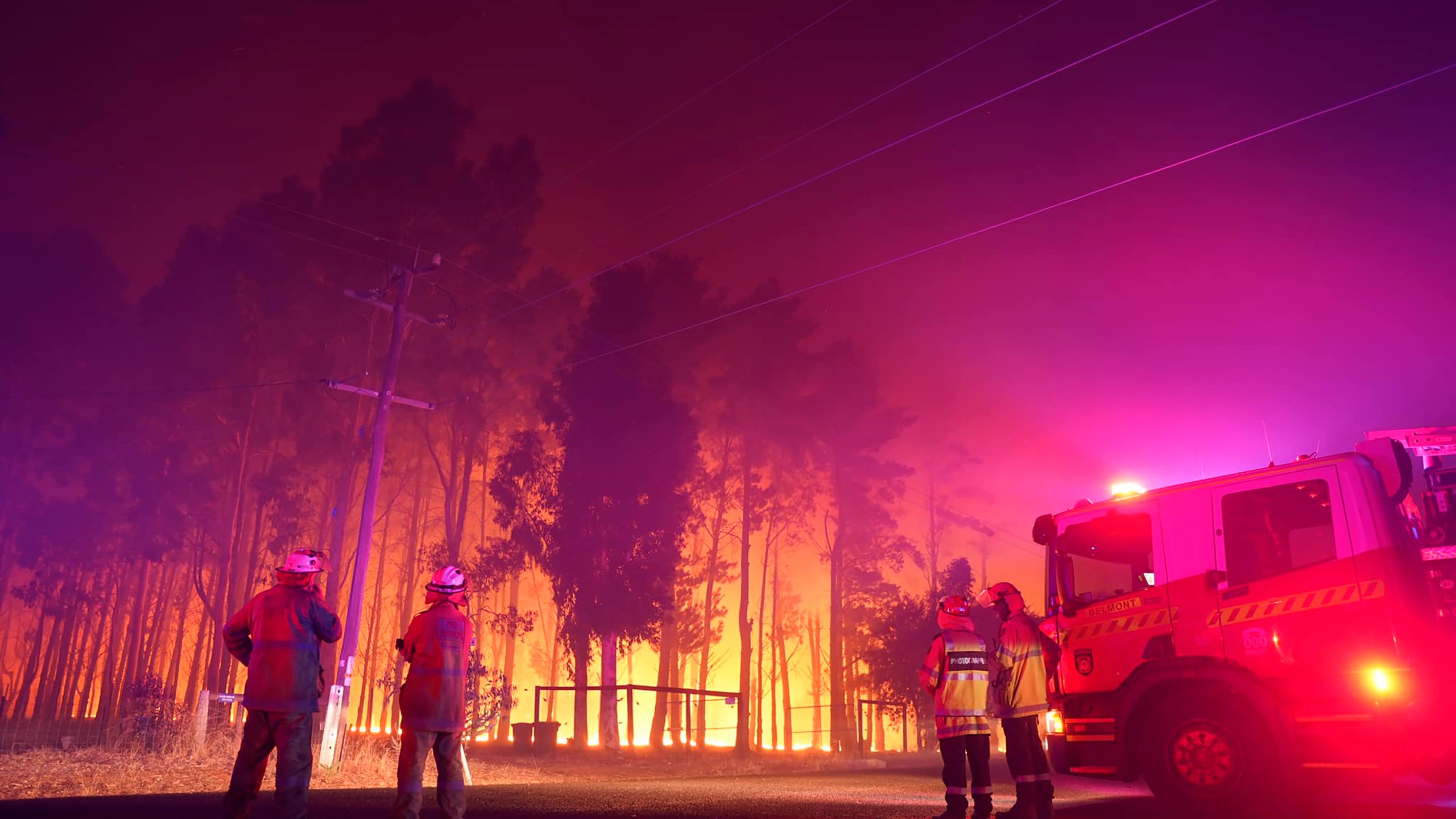 Firefighters attend a fire at Wooroloo, near Perth, Australia, on Feb. 1, 2021. (Evan Collis / Department of Fire and Emergency Services via Associated Press)