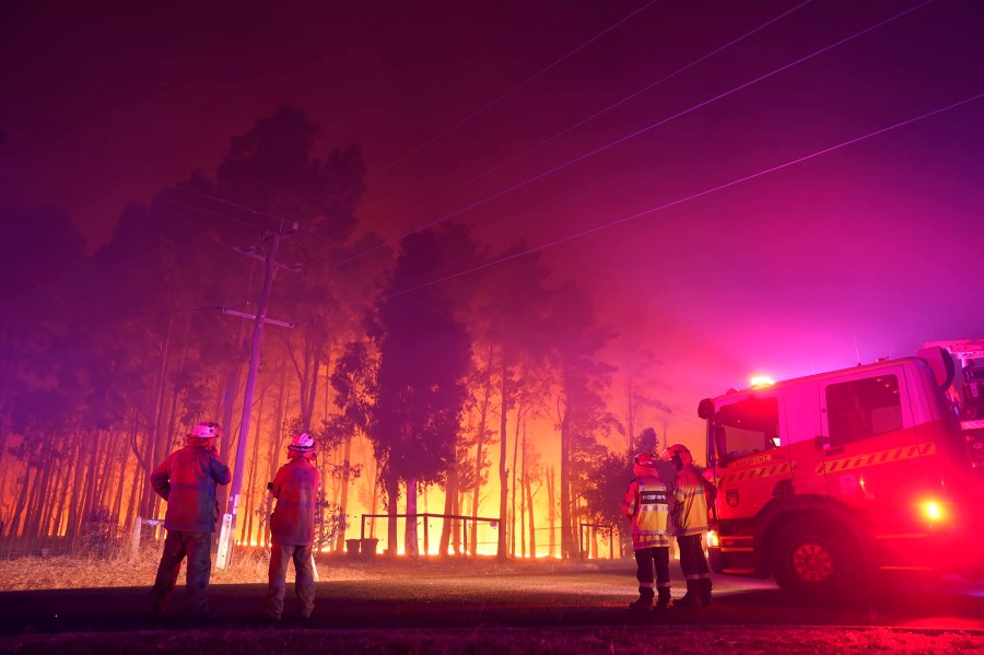 Firefighters attend a fire at Wooroloo, near Perth, Australia, on Feb. 1, 2021. (Evan Collis / Department of Fire and Emergency Services via Associated Press)