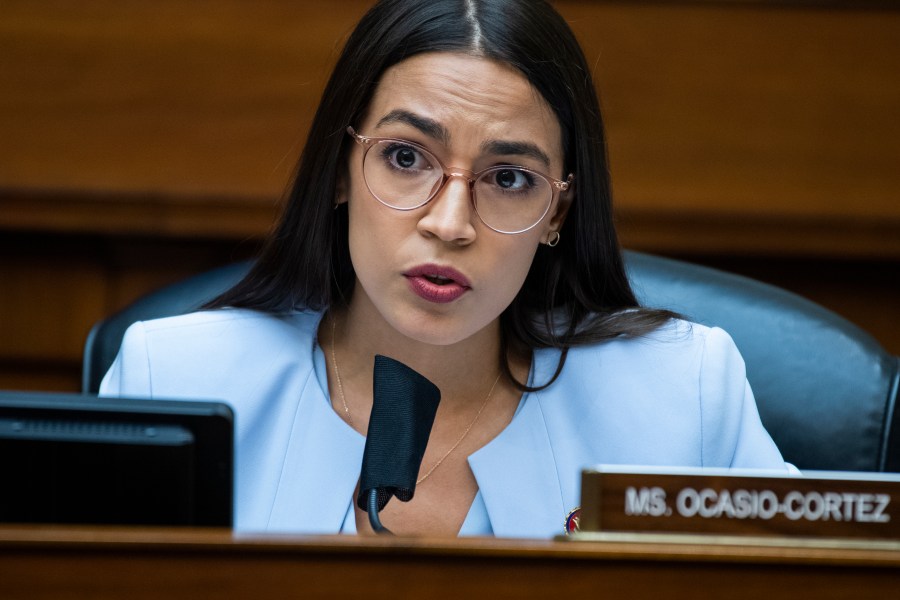 In this Monday, Aug. 24, 2020, file photo, U.S. Rep. Alexandria Ocasio-Cortez, D-N.Y., questions Postmaster General Louis DeJoy during a House Oversight and Reform Committee hearing on the Postal Service on Capitol Hill, in Washington. On Monday, Feb. 1, 2021, a teary-eyed Ocasio-Cortez recounted hiding in her office bathroom as a man repeatedly yelled “Where is she?" during the insurrection at the U.S. Capitol, and also revealed a sexual assault in her past as she talked about trauma. (Tom Williams/Pool Photo via AP, File)