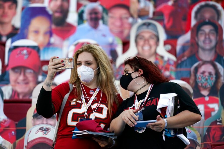 Tampa Bay Buccaneers fans take photos before the NFL Super Bowl 55 football game between the Kansas City Chiefs and Tampa Bay Buccaneers, Sunday, Feb. 7, 2021, in Tampa, Fla. (AP Photo/Ashley Landis)