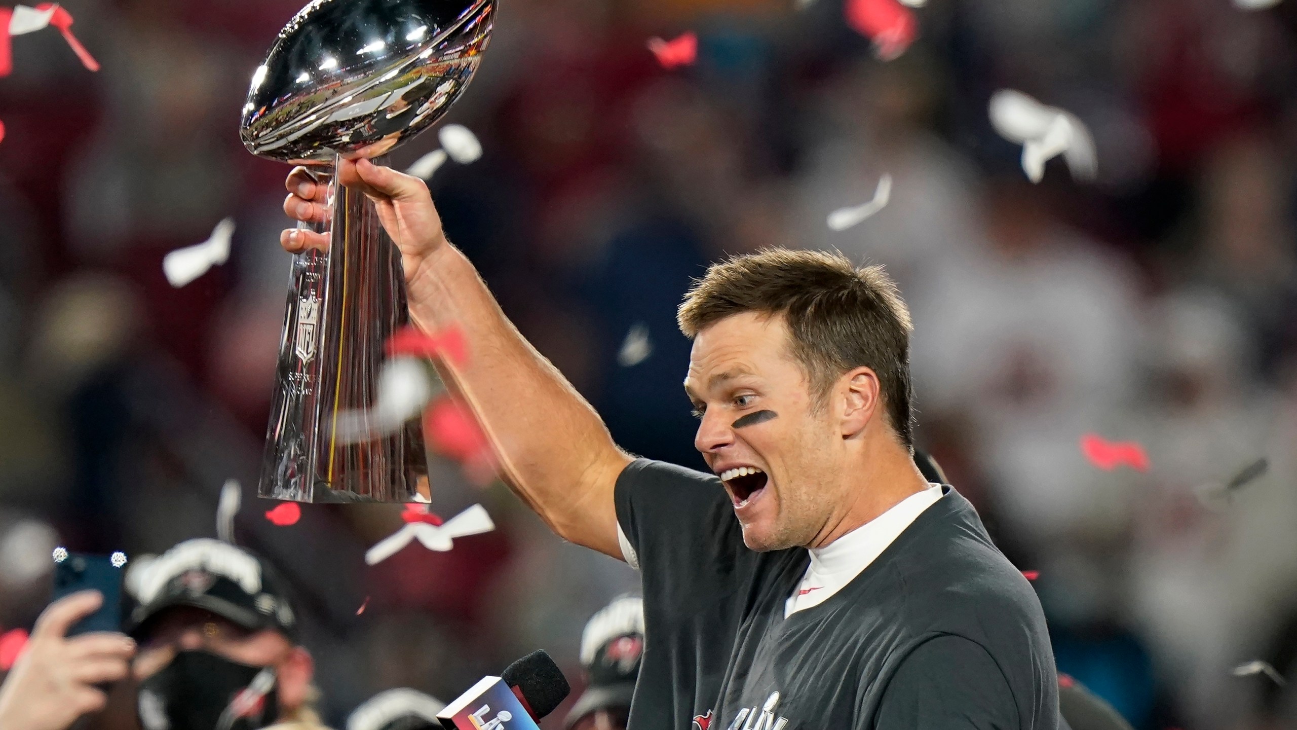 Tampa Bay Buccaneers quarterback Tom Brady celebrates with the Vince Lombardi Trophy after the NFL Super Bowl 55 football game against the Kansas City Chiefs Sunday, Feb. 7, 2021, in Tampa, Fla. (AP Photo/Lynne Sladky)