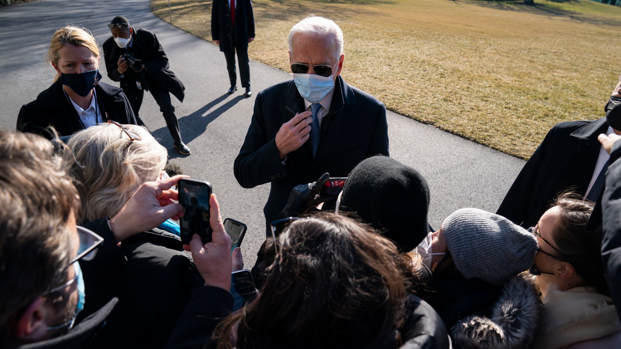 President Joe Biden talks with reporters after arriving on the South Lawn of the White House on Feb. 8, 2021. (Evan Vucci / Associated Press)