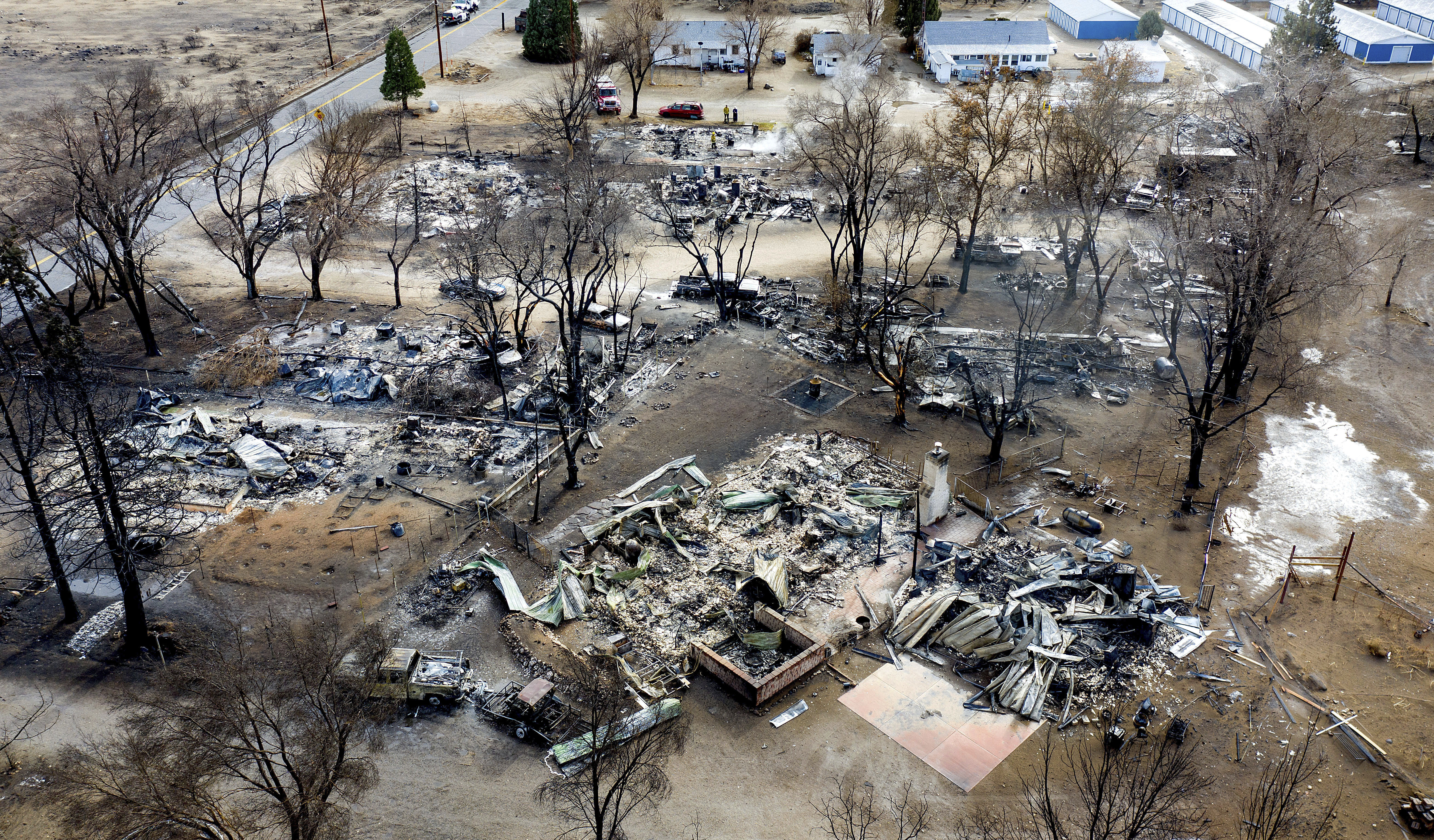 In this Nov. 18, 2020 file photo taken by a drone, residences destroyed by the Mountain View Fire line a street in the Walker community in Mono County, Calif. (AP Photo/Noah Berger)