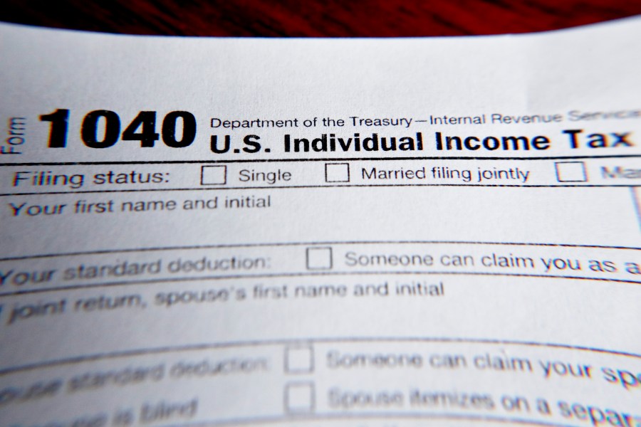 This Wednesday, Feb. 13, 2019 file photo shows part of a 1040 federal tax form printed from the Internal Revenue Service website, in Zelienople, Pa. Tax filing season will start a bit later and look a bit different this year. That’s because the pandemic that defined 2020 has seeped into tax time as well. If you worked from home, received a relief payment, took on some gig work or filed unemployment benefits _ or someone filed a fake claim in your name _ there are things you need to be aware of. Likewise if you normally receive certain tax credits. The IRS will begin accepting tax returns on Feb. 12, 2021. (AP Photo/Keith Srakocic, File)