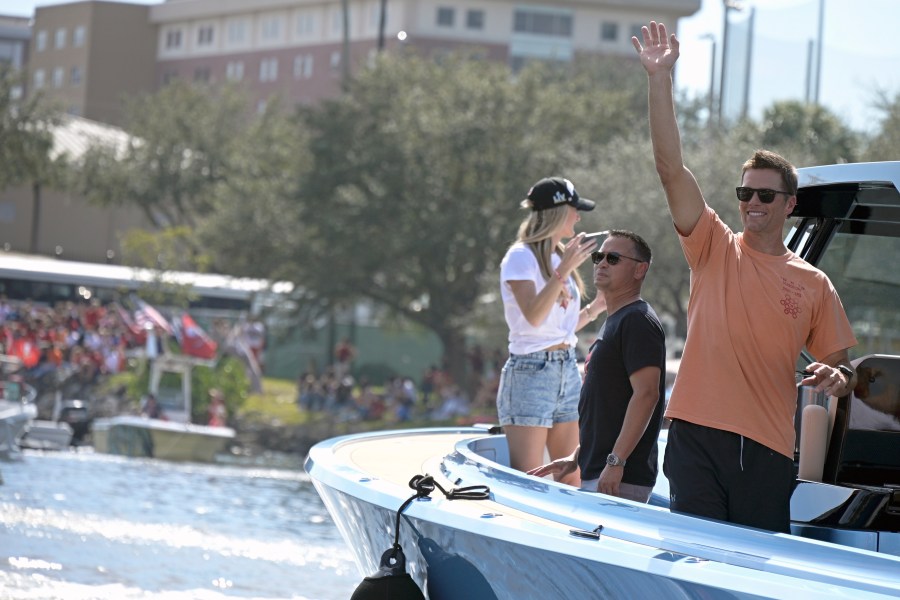 Tampa Bay Buccaneers NFL football quarterback Tom Brady waves to fans as he celebrates their Super Bowl 55 victory over the Kansas City Chiefs with a boat parade in Tampa on Feb. 10, 2021. (Phelan Ebenhack/Associated Press)