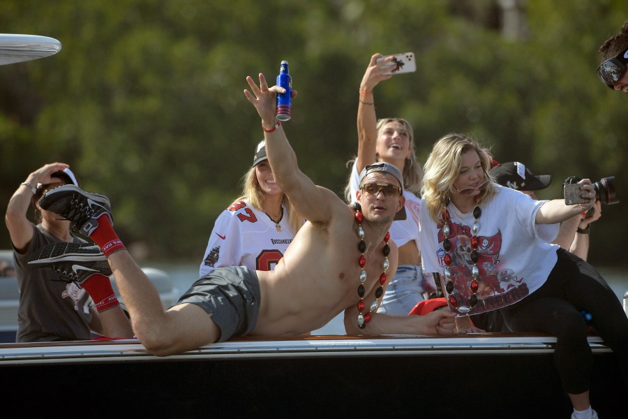 Tampa Bay Buccaneers NFL football tight end Rob Gronkowski waves during a celebration of their Super Bowl 55 victory over the Kansas City Chiefs with a boat parade in Tampa on Feb. 10, 2021. (Phelan Ebenhack/Associated Press)