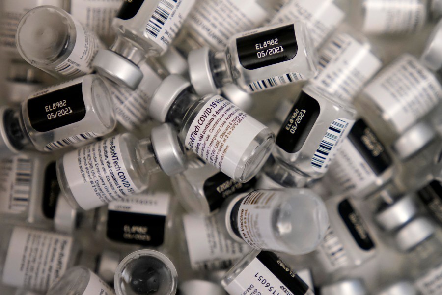 In this Jan. 22, 2021, file photo, empty vials of the Pfizer-BioNTech COVID-19 vaccine are seen at a vaccination center at the University of Nevada, Las Vegas, in Las Vegas. (AP Photo/John Locher, File)