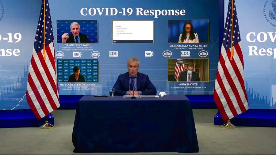 In this Jan. 27, 2021, image from video, White House coronavirus response coordinator Jeff Zients (center) speaks during a White House briefing on the Biden administration's response to the COVID-19 pandemic in Washington. (White House via AP)