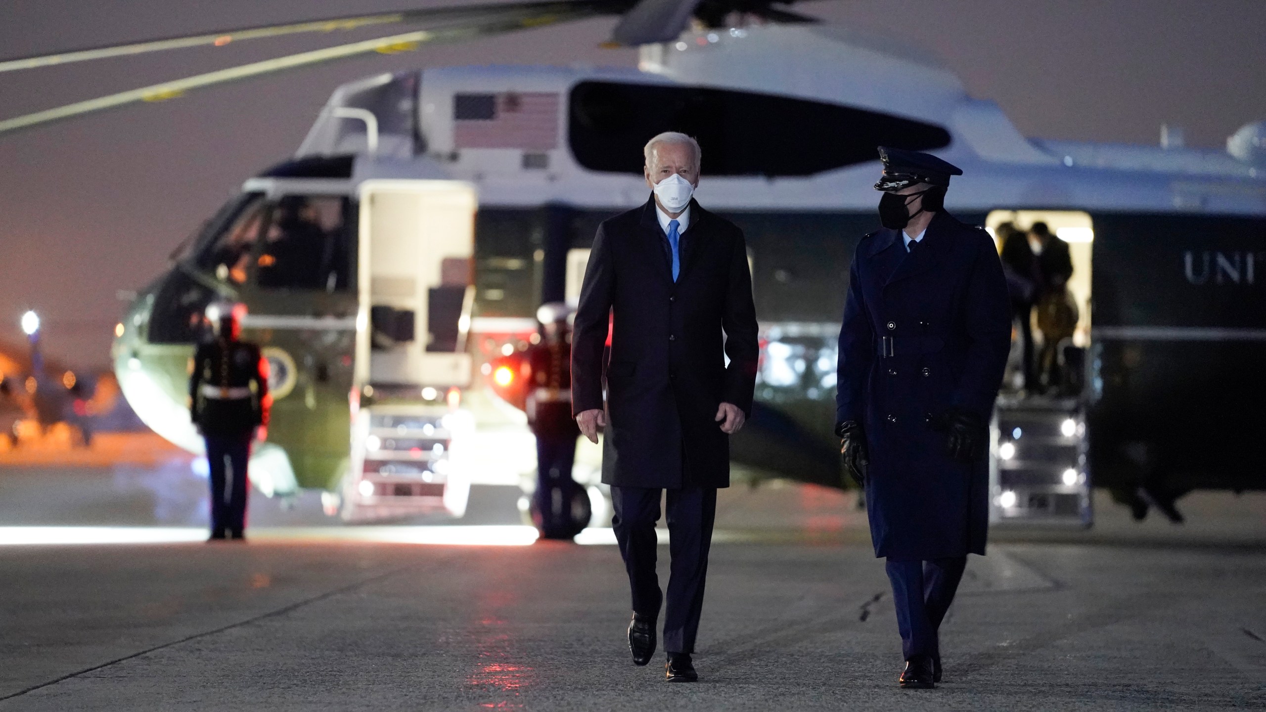 President Joe Biden walks to board Air Force One for a trip to Camp David, Friday, Feb. 12, 2021, in Andrews Air Force Base, Md. (AP Photo/Evan Vucci)