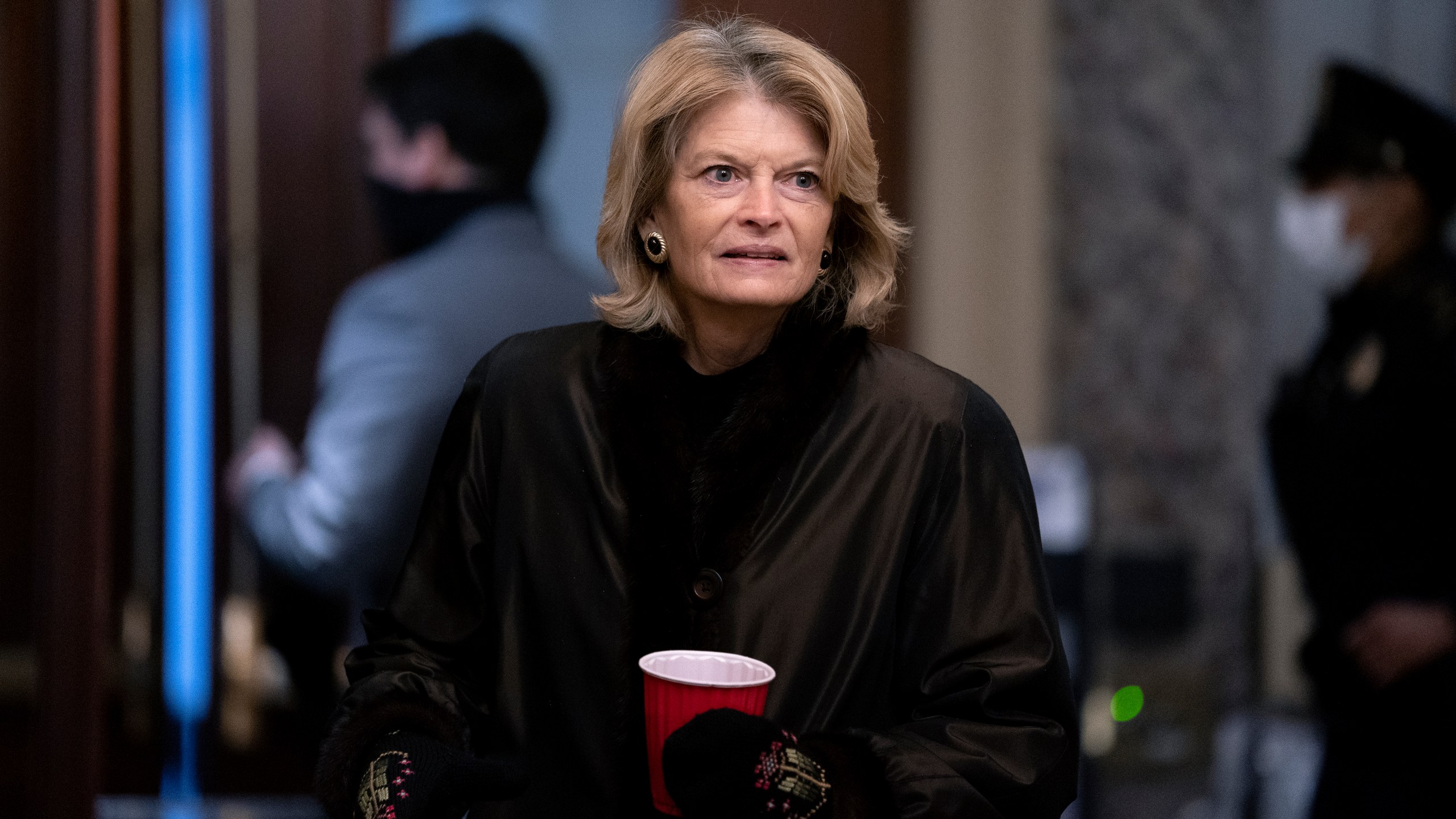 Sen. Lisa Murkowski, R-Alaska, arrives at the start of the fifth day of the second impeachment trial of former President Trump, Saturday, Feb. 13, 2021 at the Capitol in Washington. (Stefani Reynolds/Pool via AP)