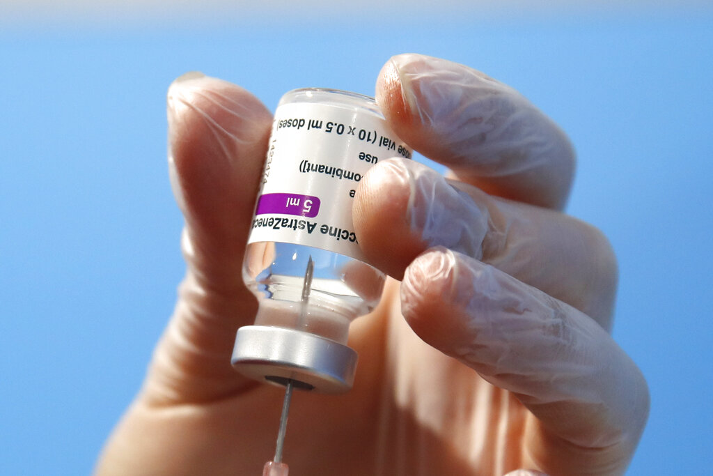 In this file photo dated Feb. 11, 2021, a health worker prepares a dose of the AstraZeneca vaccine to be administered in Fiumicino, near Rome's international airport. (Alessandra Tarantino/Associated Press)