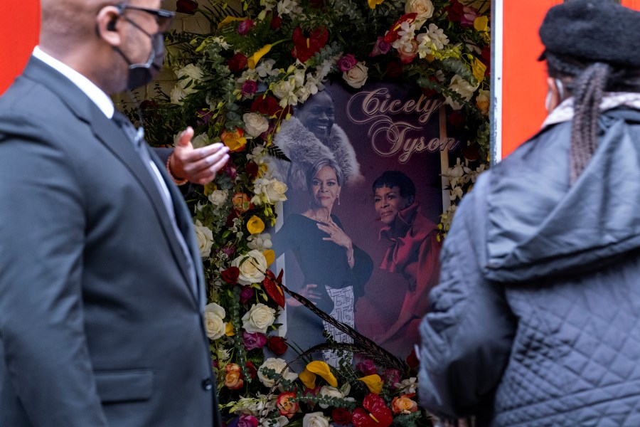 A photo collage of Cicely Tyson greets people arriving just inside the Abyssinian Baptist Church in the Harlem neighborhood of New York where a public viewing was held Monday, Feb. 15, 2021, for  Tyson, who died Jan. 28.  Tyson, the pioneering Black actress who gained an Oscar nomination for her role as the sharecropper's wife in "Sounder," a Tony Award in 2013 at age 88 and touched TV viewers' hearts in "The Autobiography of Miss Jane Pittman," was 96. (AP Photo/Craig Ruttle)