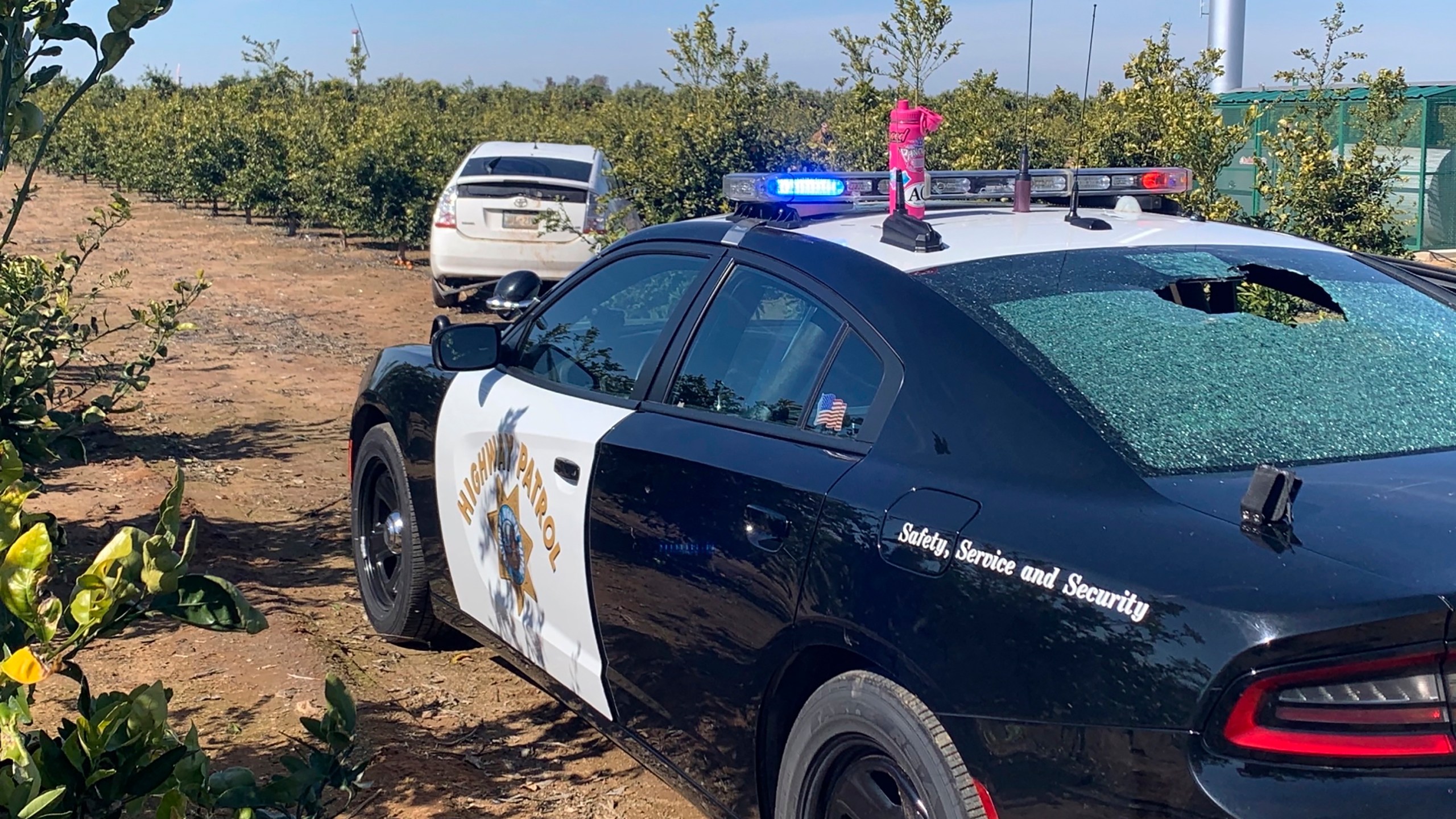 This photo provided by the Tulare County Sheriff's Office shows a shot-out rear window of a California Highway Patrol vehicle in Exeter, Tulare County, in central California, on Feb. 19, 2021.