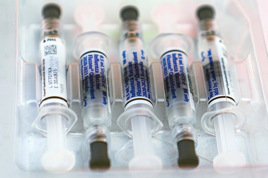 This Oct. 17, 2020, file photo shows influenza vaccine syringes at the L.A. Care Health Plan and Blue Shield of California Promise Health Plan's Community Resource Center's Free Drive-Thru vaccination event in Los Angeles. (AP Photo/Damian Dovarganes)