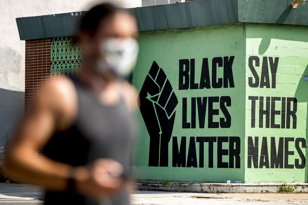 In this July 13, 2020, file photo, a black lives matter mural is visible in the Shaw neighborhood in Washington. (AP Photo/Andrew Harnik, File)