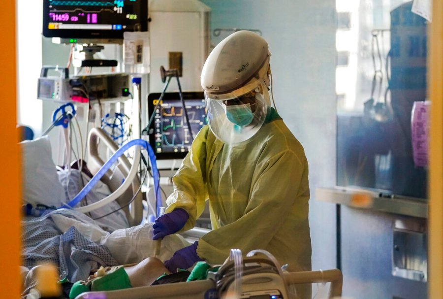 In this Wednesday, Jan. 13, 2021, file photo, a health care worker tends to a COVID-19 patient in the intensive care unit at Santa Clara Valley Medical Center during the coronavirus pandemic in San Jose, California. (AP Photo/Jeff Chiu, File)