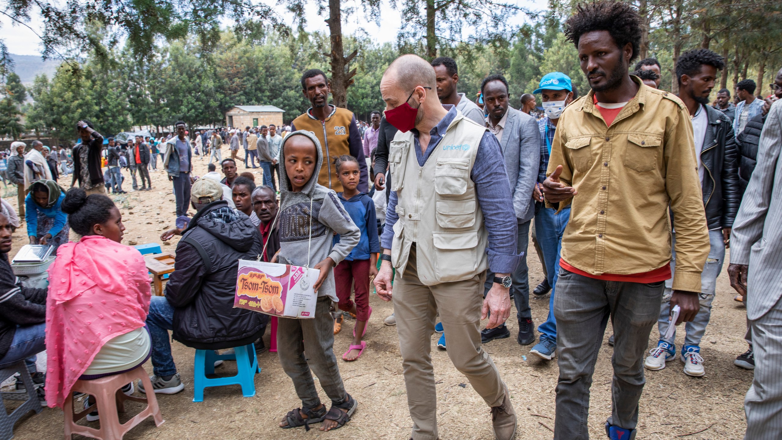 Manuel Fontaine, UNICEF Director of the Office of Emergency Programmes, center, visits internally-displaced people in Adigrat Town, in the Tigray region of northern Ethiopia Monday, Feb. 22, 2021. (Zerihun Sewunet/UNICEF via AP)