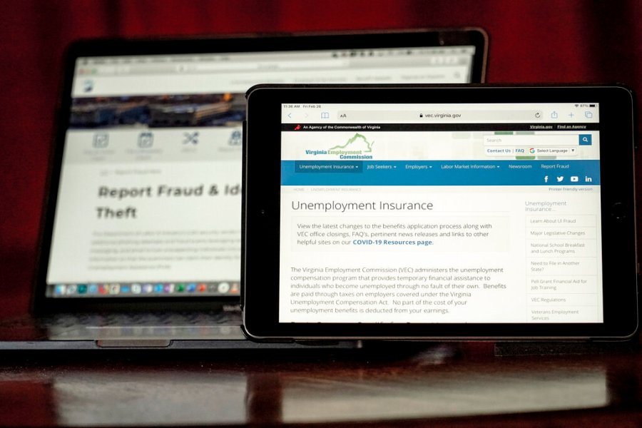 Web pages used to show information for collecting unemployment insurance in Virginia, right, and reporting fraud and identity theft in Pennsylvania, are displayed on the respective state web pages, Friday, Feb. 26, 2021, in Zelienople, Pa. (AP Photo/Keith Srakocic)