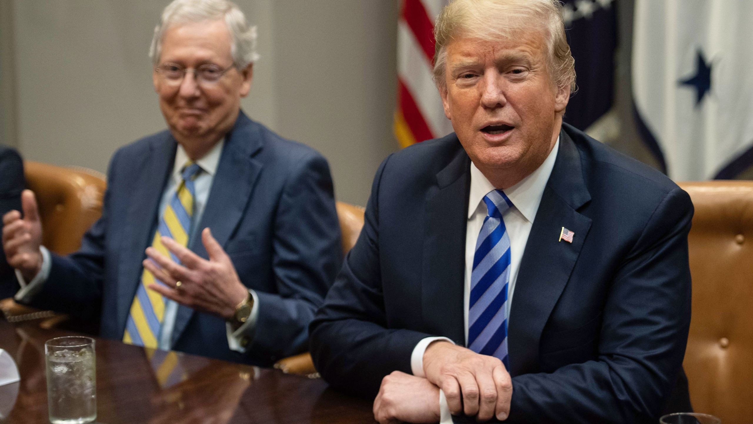 Senate Majority Leader Mitch McConnell, left, reacts as President Donald Trump speaks to the press before a meeting with Republican Congressional leaders at the White House in Washington, DC, on September 5, 2018. (NICHOLAS KAMM/AFP via Getty Images)