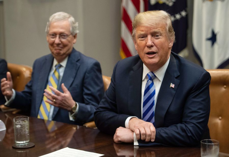 Senate Majority Leader Mitch McConnell, left, reacts as President Donald Trump speaks to the press before a meeting with Republican Congressional leaders at the White House in Washington, DC, on September 5, 2018. (NICHOLAS KAMM/AFP via Getty Images)