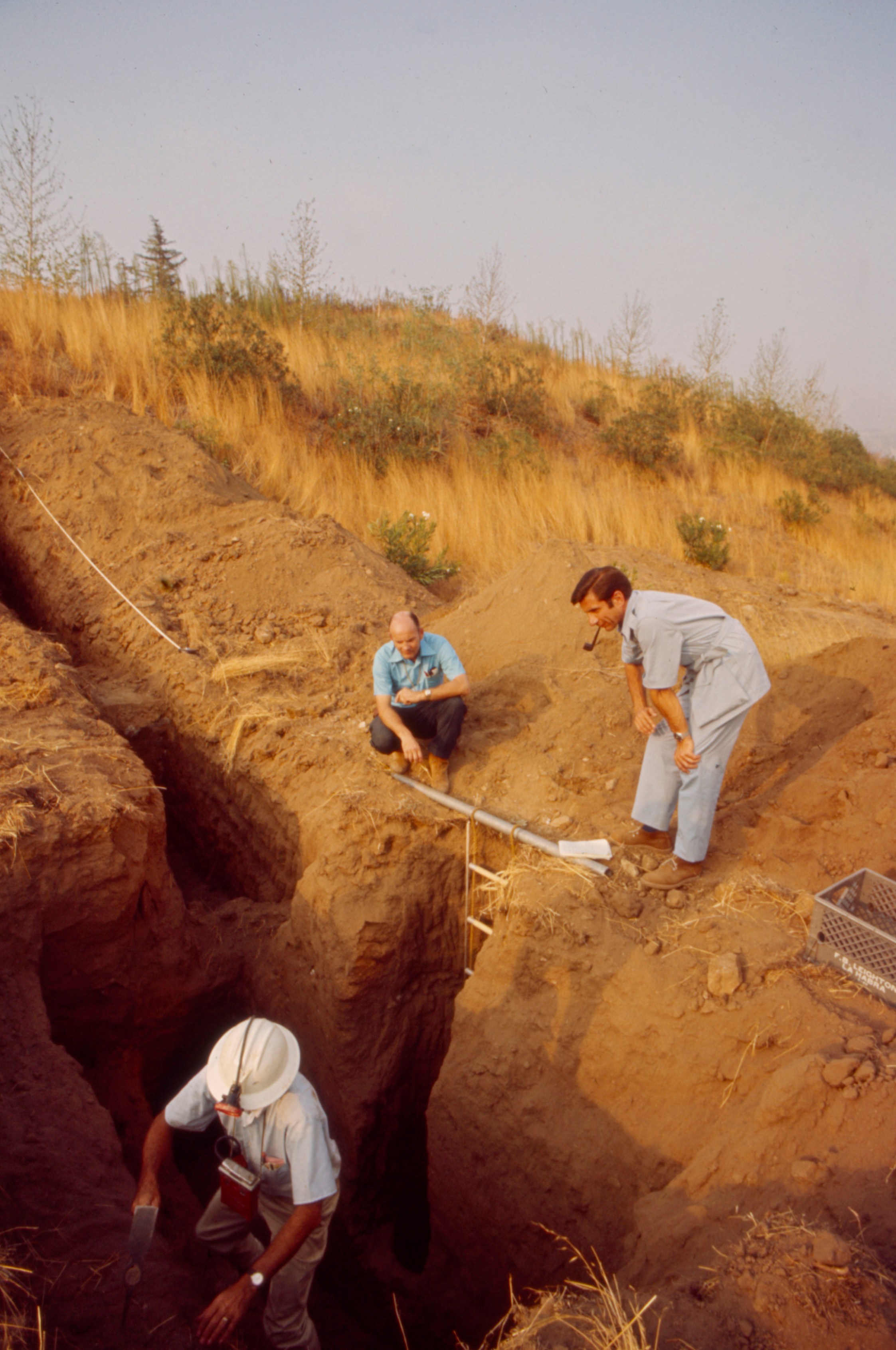 From left: F. Beach Leighton, Jules Bergman examine fault line trench after the Sylmar Earthquake / 1971 San Fernando earthquake, in the Walt Disney Television via Getty Images / GE Monogram series episode "The Violent Earth." (Walt Disney Television via Getty Images)