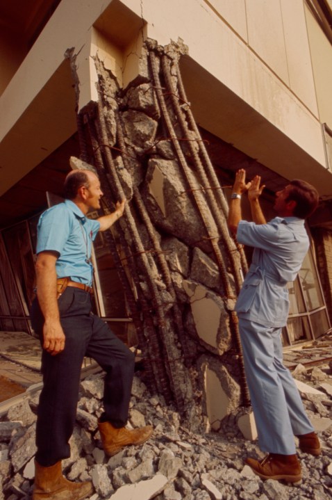 From left: F. Beach Leighton, Jules Bergman examining earthquake damage at the Olive View Medical Center in the aftermath of the Sylmar Earthquake / 1971 San Fernando earthquake, in the Walt Disney Television via Getty Images / GE Monogram series episode "The Violent Earth." (Walt Disney Television via Getty Images)