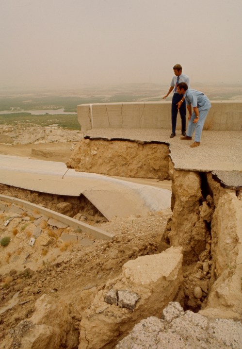 From left: Duane L. Georgeson, Jules Bergman examine damage in the aftermath of the Sylmar Earthquake / 1971 San Fernando earthquake, in the Walt Disney Television via Getty Images / GE Monogram series episode "The Violent Earth." (Walt Disney Television via Getty Images)