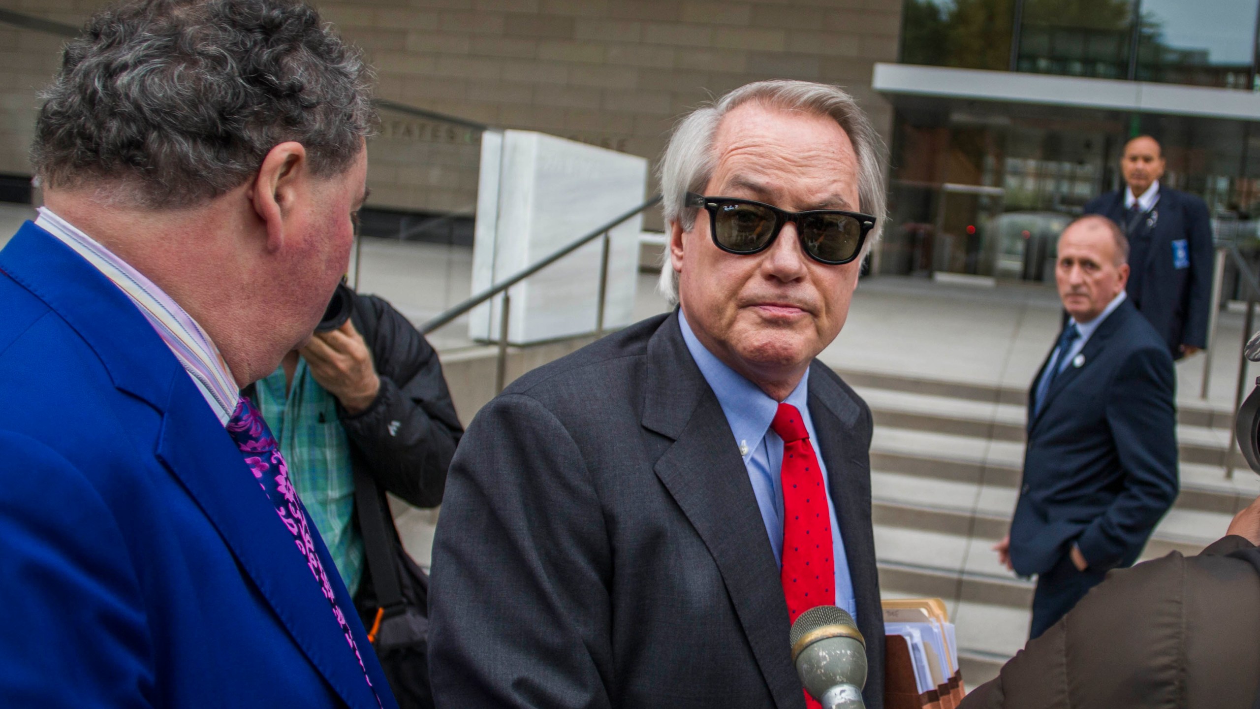 Attorney L. Lin Wood, center, speaks to the media at the U.S. District Court in Los Angeles on Dec. 3, 2019. (Apu Gomes/Getty Images)