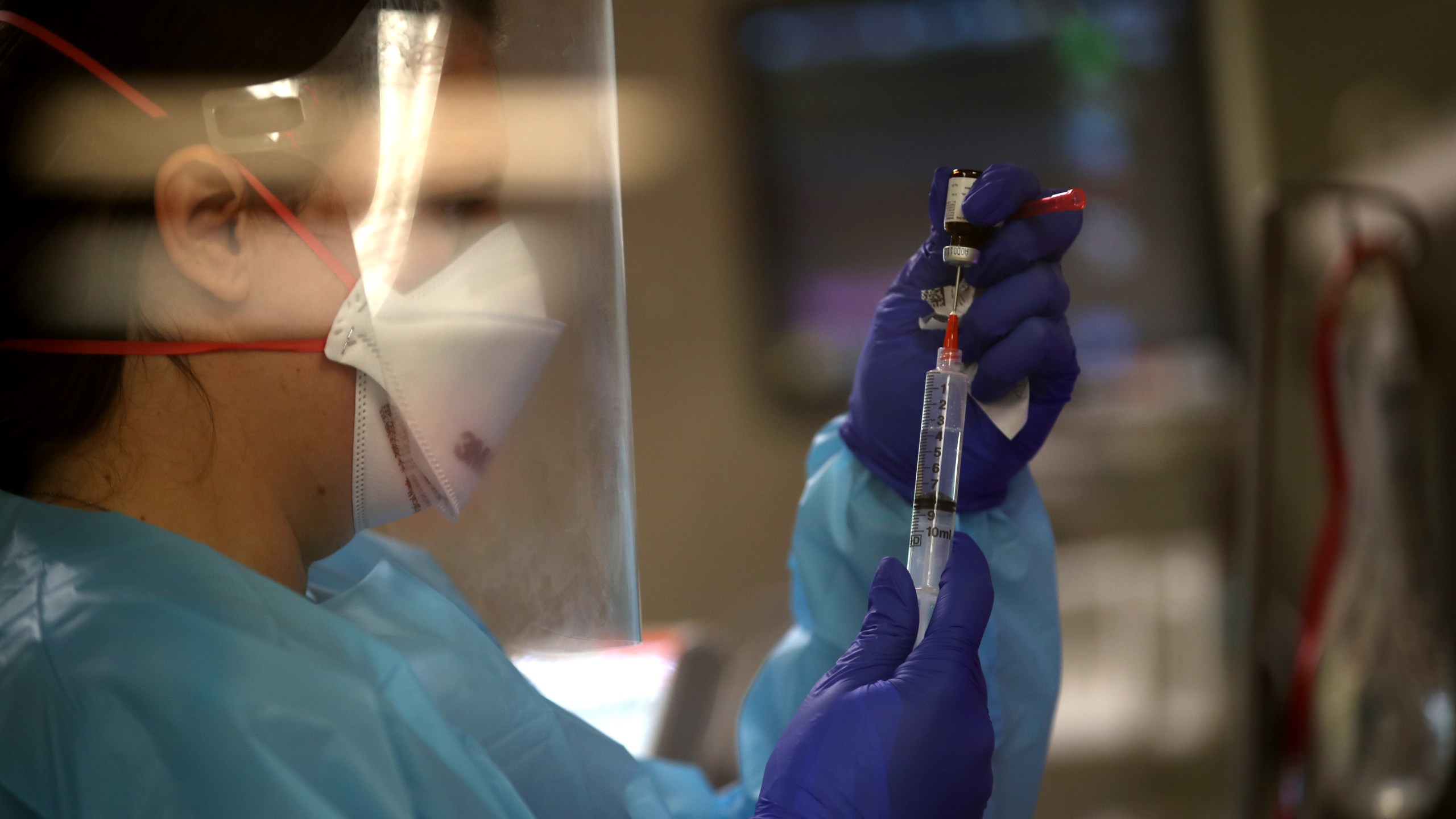 A nurse prepares medication as she cares for a coronavirus COVID-19 patient in the intensive care unit at Regional Medical Center on May 21, 2020 in San Jose, California. Frontline workers are continuing to care for coronavirus COVID-19 patients throughout the San Francisco Bay Area. Santa Clara county, where this hospital is located, has had the most deaths of any Northern California county, and the earliest known COVID-19 related deaths in the United States. (Photo by Justin Sullivan/Getty Images)