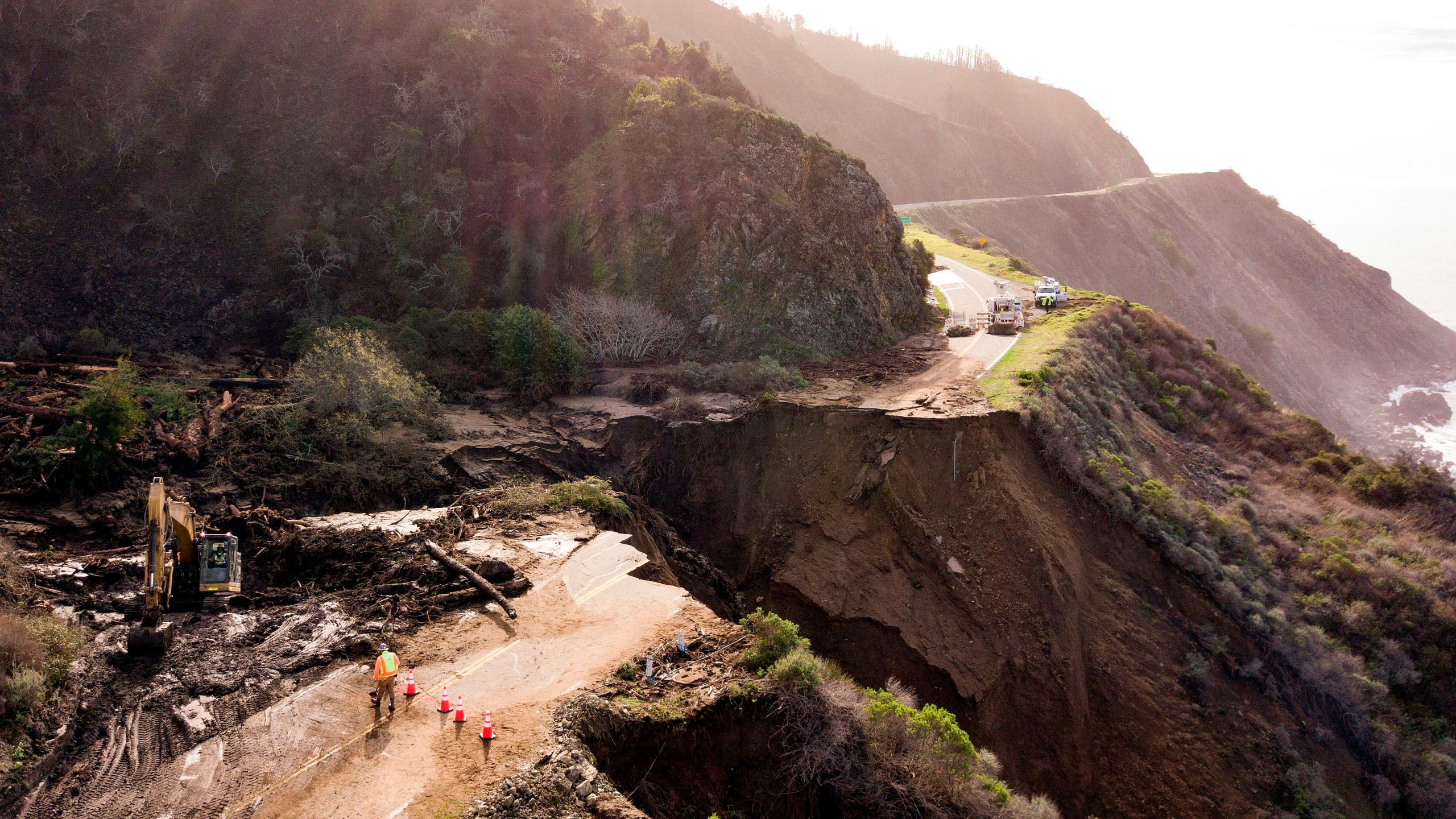 Construction crews work on a section of Highway 1 which collapsed into the Pacific Ocean near Big Sur, California on January 31, 2021.(Josh Edelson/AFP via Getty Images)