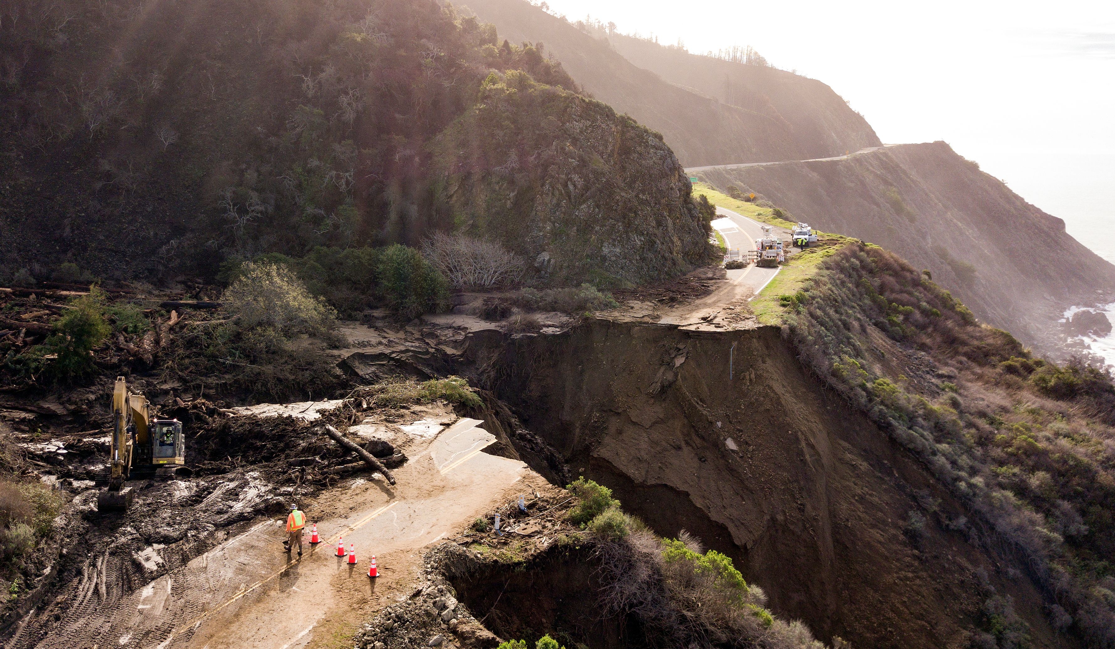 Construction crews work on a section of Highway 1 which collapsed into the Pacific Ocean near Big Sur, California on January 31, 2021.(Josh Edelson/AFP via Getty Images)