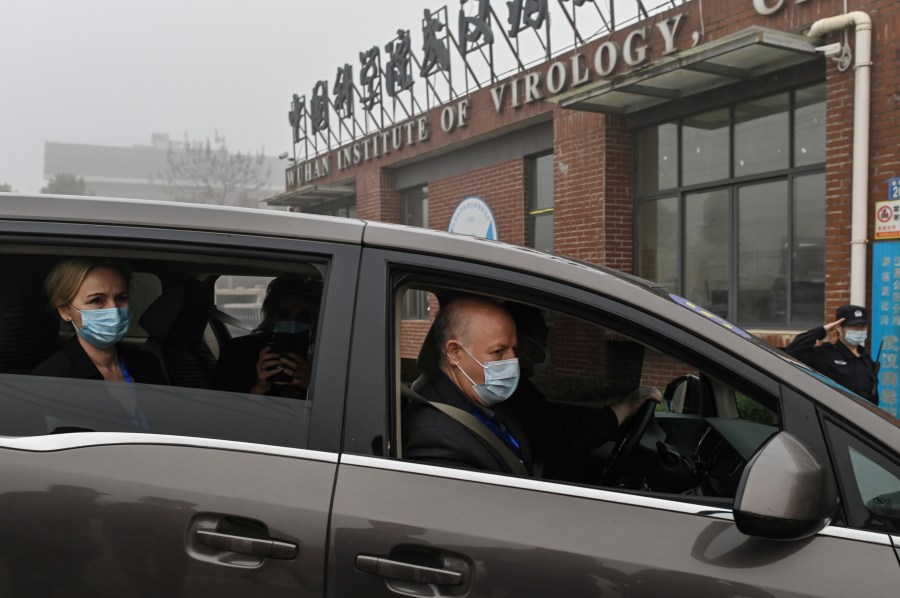 Peter Daszak, right, Thea Fischer, left, and other members of the World Health Organization team investigating the origins of the COVID-19 pandemic arrive at the Wuhan Institute of Virology in Wuhan in China's central Hubei province on Feb. 3, 2021. (Hector Retamal / AFP / Getty Images)