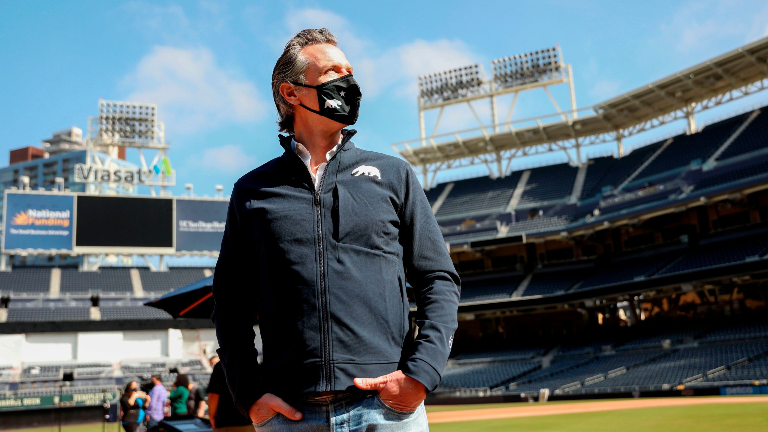 California Gov. Gavin Newsom looks on before speaking to members of the media during a press conference at Petco Park, February 8, 2021 in San Diego. (SANDY HUFFAKER/POOL/AFP via Getty Images)