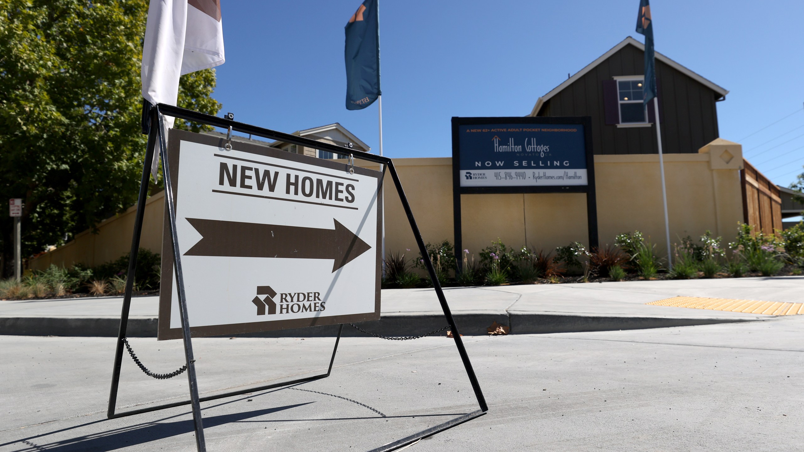 A sign is posted in front of new homes for sale at Hamilton Cottages on Sept. 24, 2020 in Novato. (Justin Sullivan/Getty Images)