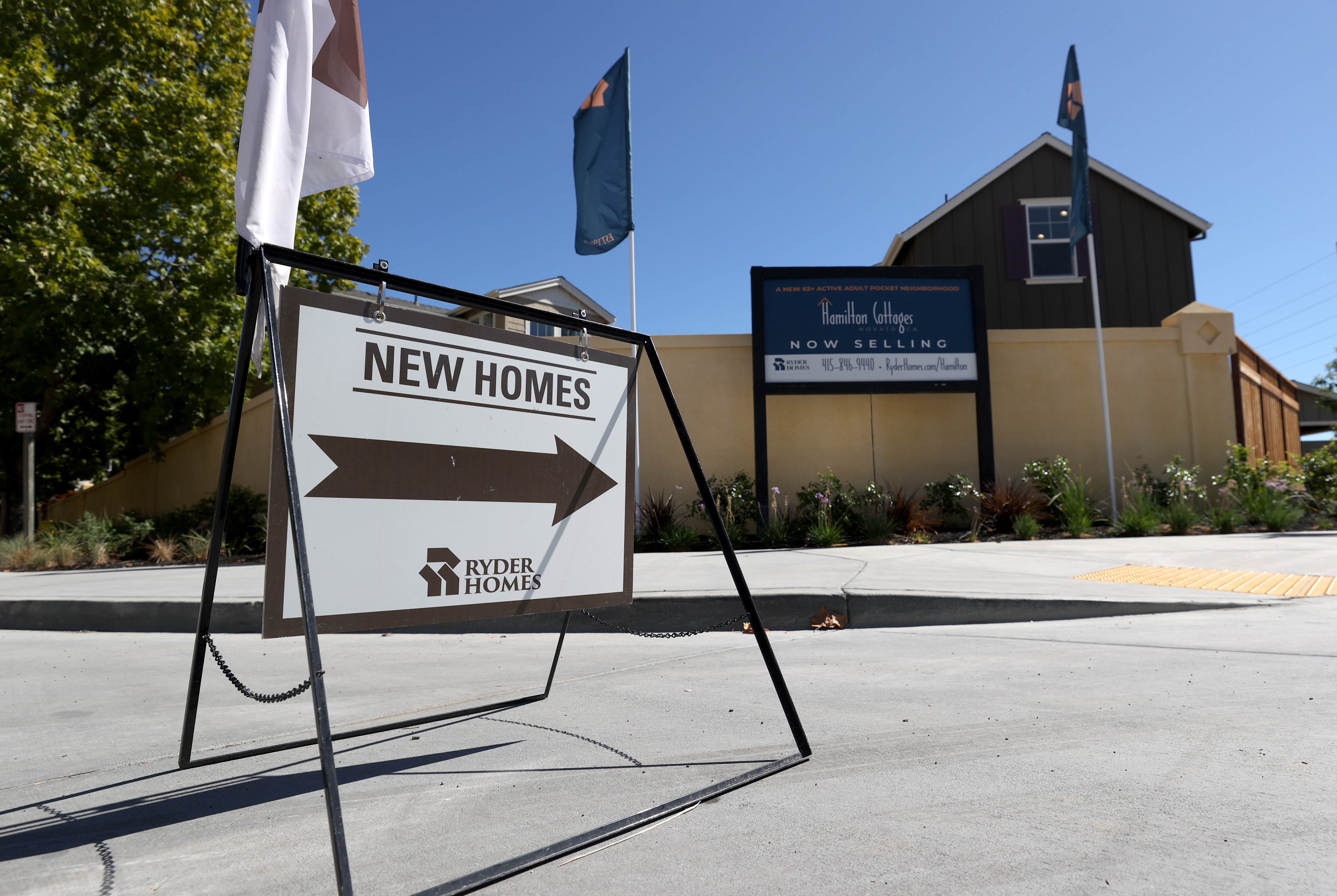 A sign is posted in front of new homes for sale at Hamilton Cottages on Sept. 24, 2020 in Novato. (Justin Sullivan/Getty Images)